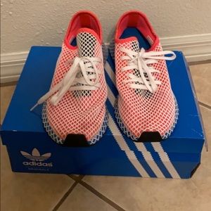 red and blue adidas shoe